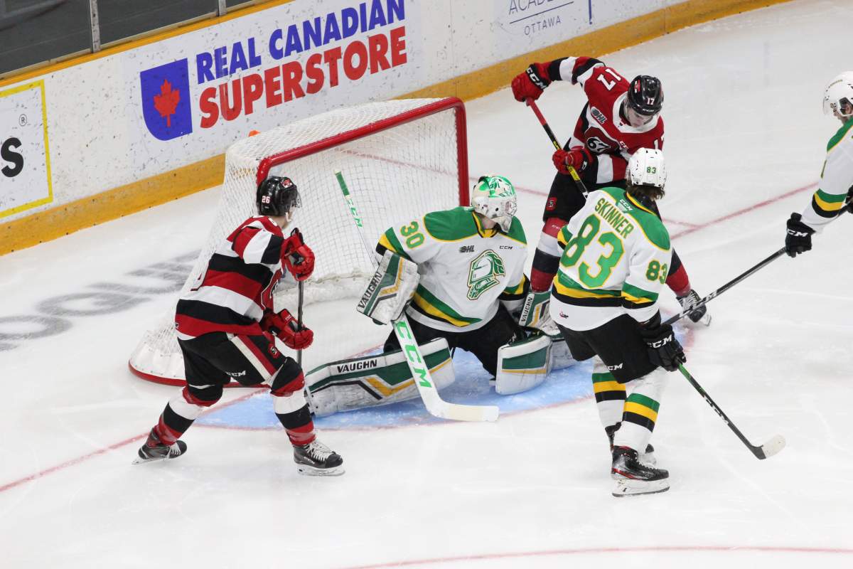 London Knights goaltender Brett Brochu lunges a leg across the crease to make a save against the Ottawa 67's.