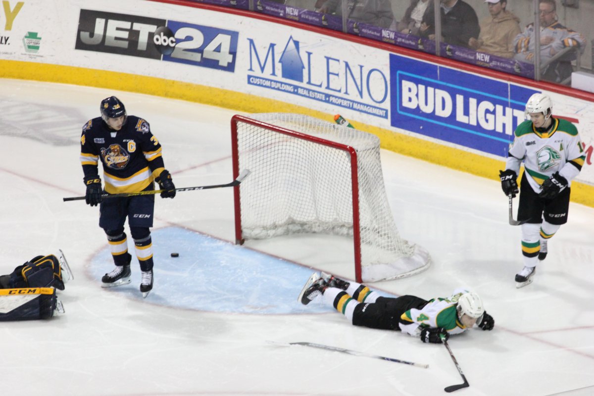 Jonathan Gruden of the London Knights lies on the ice after a swim-style celebration as he and the Knights defeated the Erie Otters 6-3 at the Erie Insurance Arena on March 1, 2020.