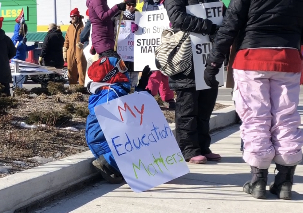 Child at St Thomas teachers strike supporting his mom who is a teacher.