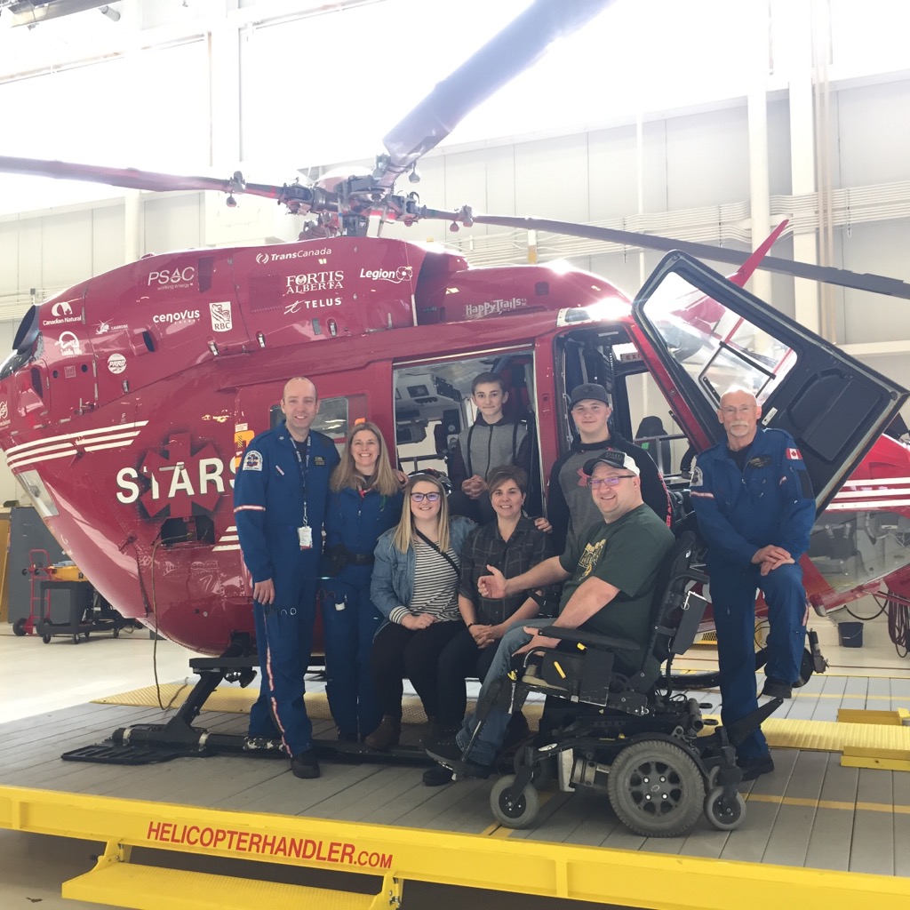 Jason Lunn poses with the STARS crew