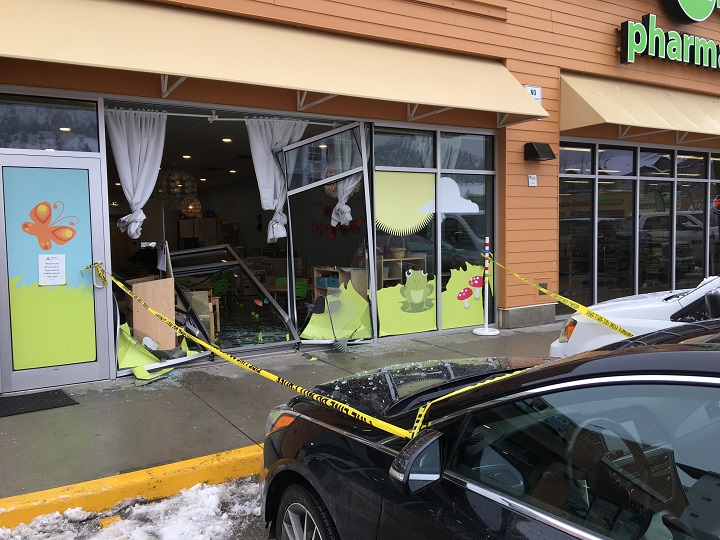 A Kelowna daycare has cancelled its junior kindergarten classes for the day after a car crashed into the front of the business, shattering its windows.