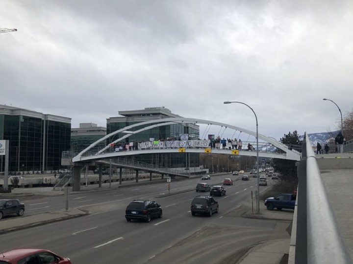 Protesters in solidarity with the Wet'suwet'en hereditary chiefs gathered along an overpass in Kelowna on Saturday.