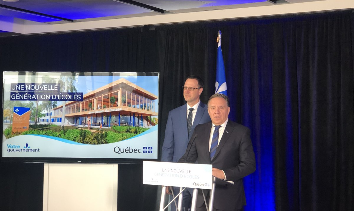Quebec Premier François Legault alongside Quebec Education Minister Jean-François Roberge at a press conference on Tuesday, Feb. 25. 
