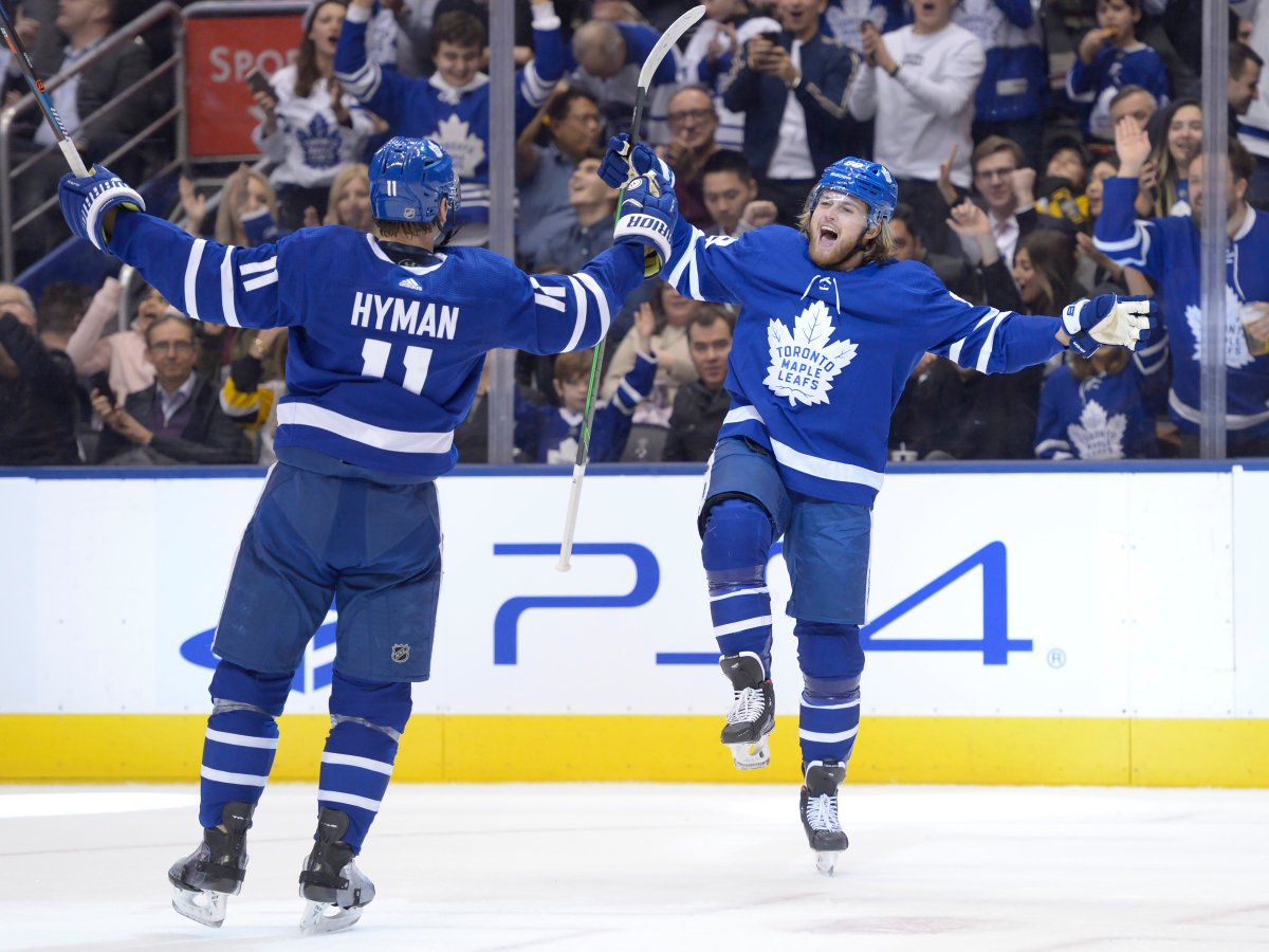 Toronto Maple Leafs right winger William Nylander (88) celebrates his goal against the Pittsburgh Penguins with teammate Zach Hyman (11) in Toronto on Thursday, Feb. 20, 2020.