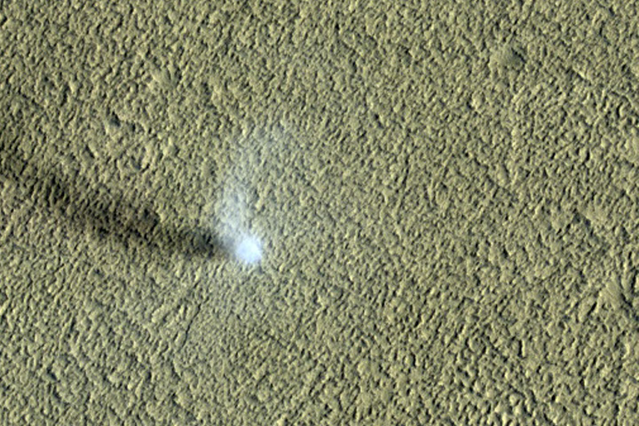 A dust devil is shown on the surface of Mars in this photo captured by the HiRISE camera on NASA's Mars Reconnaissance Orbiter on Oct. 1, 2019.