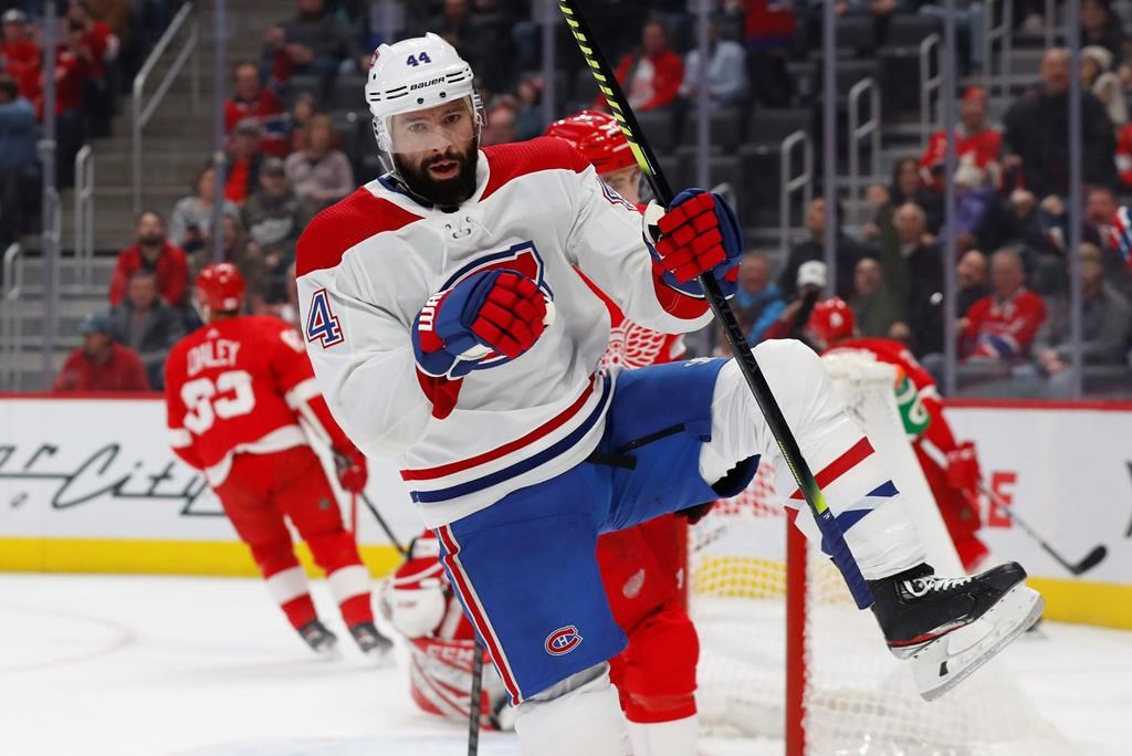 Montreal Canadiens center Nate Thompson celebrates his goal against the Detroit Red Wings during the first period of an NHL hockey game Tuesday, Feb. 18, 2020, in Detroit. (AP Photo/Paul Sancya).