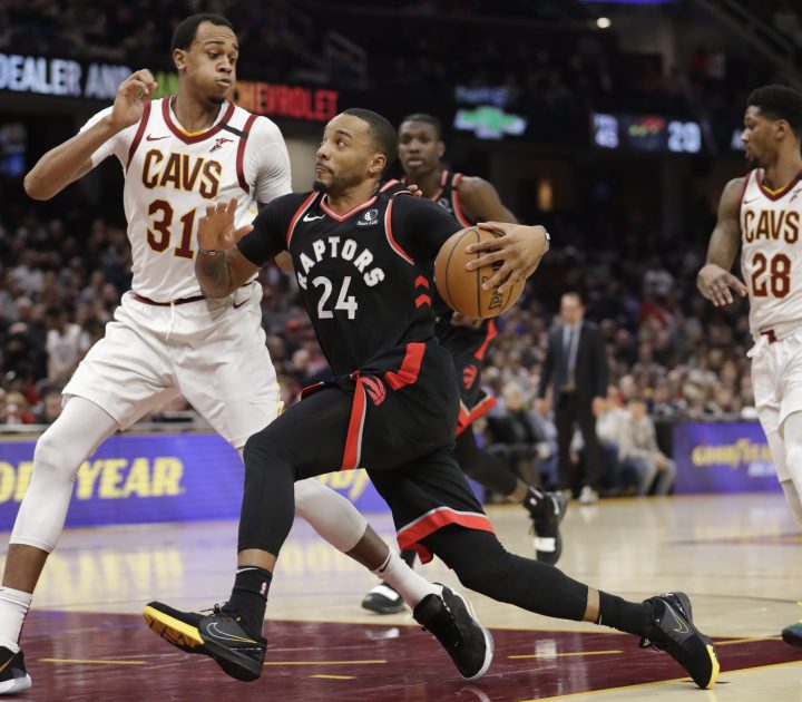 Toronto Raptors' Norman Powell (24) drives to the basket against Cleveland Cavaliers' John Henson (31) during the second half of an NBA basketball game Thursday, Jan. 30, 2020, in Cleveland.