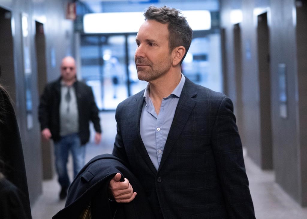 Former radio and television personality Eric Salvail arrives at the courthouse in Montreal on Wednesday.