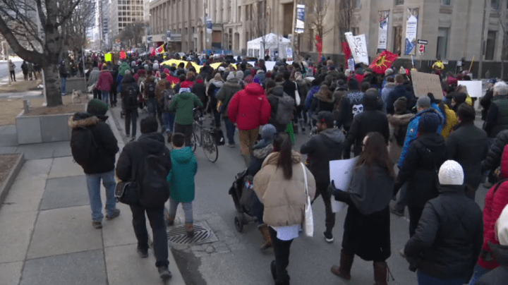 Demonstrators march down University Avenue on Saturday in solidarity with members of the Wet’suwet’en Nation who oppose the building of a pipeline through the nation’s unceded territory.