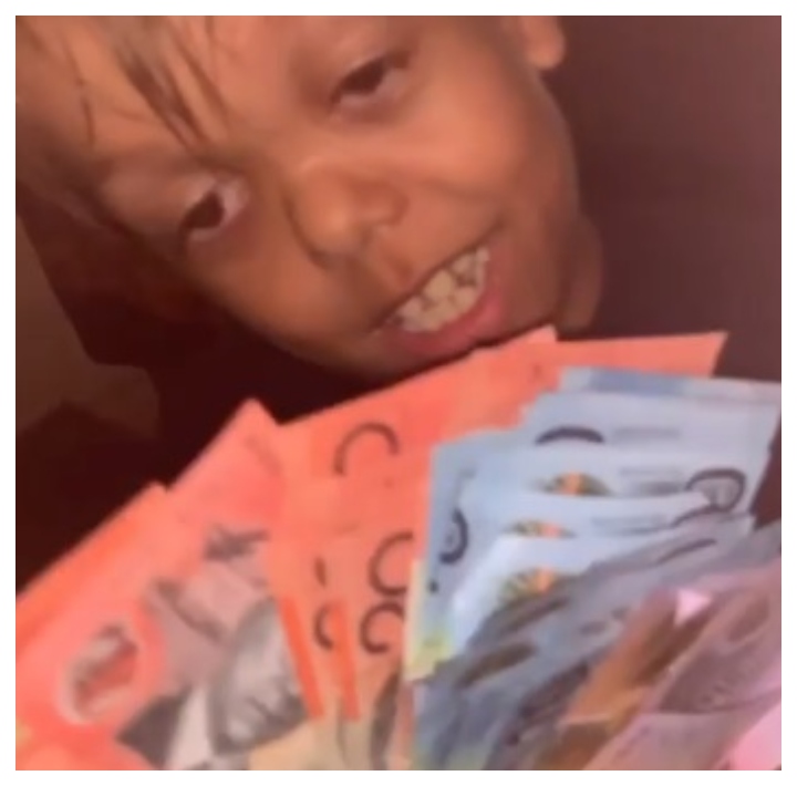 Quaden Bayles holds what appears to be currency in this image from Instagram video posted Feb. 15, 2020.
