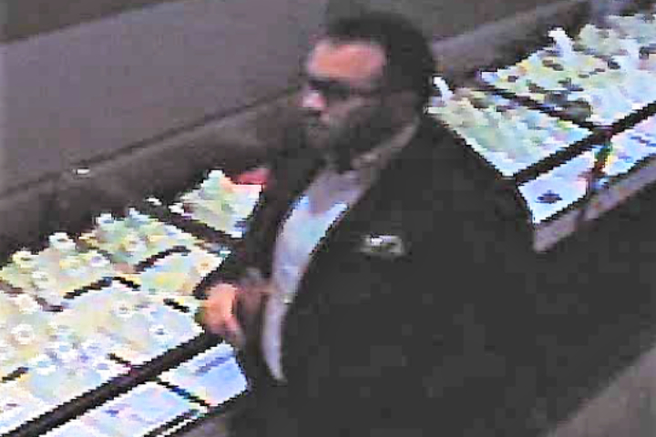 Airdrie RCMP allege this man impersonated a police officer while at CrossIron Mills on Feb. 14, 2020. 
