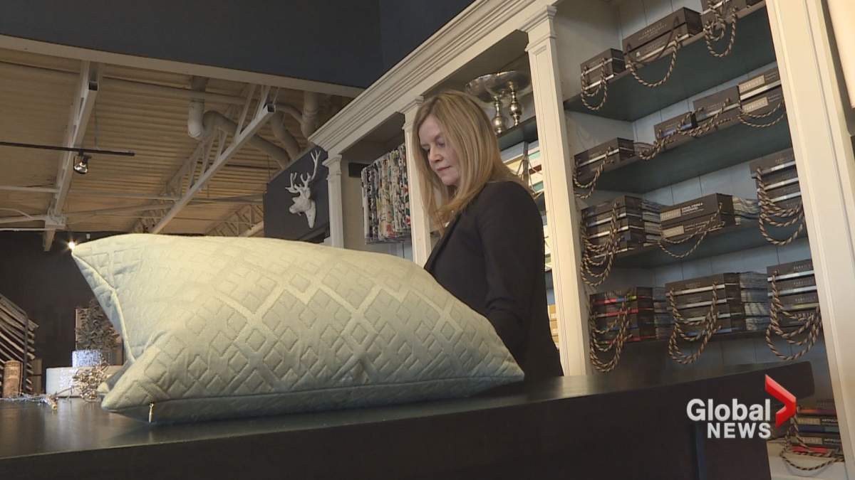 Rhonda Fairhurst organizes fabric samples in her Calgary furniture store.