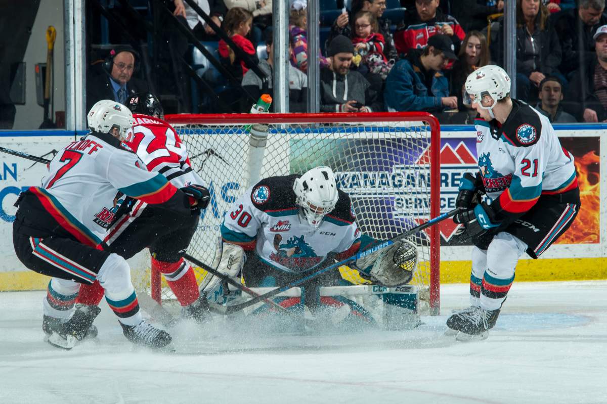 Seth Jarvis of the Portland Winterhawks scores a second period goal on Roman Basran of the Kelowna Rockets at Prospera Place on February 8, 2020.