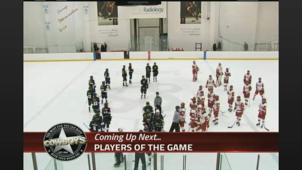 SAIT Trojans and Red Deer College Queens hockey players exchange words during a game on Feb. 8.