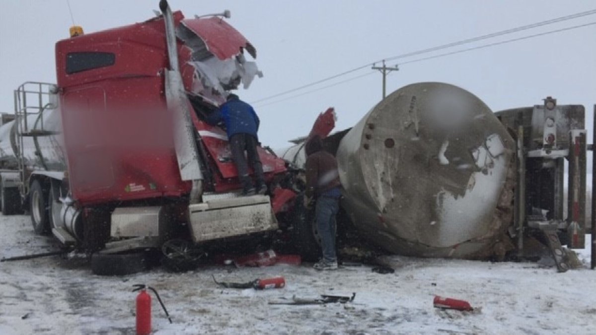 Highway 55 was closed Tuesday, Feb. 11, 2020 after a three-vehicle collision near Township Road 674. Global News has blurred identifiable information on the trucks.
