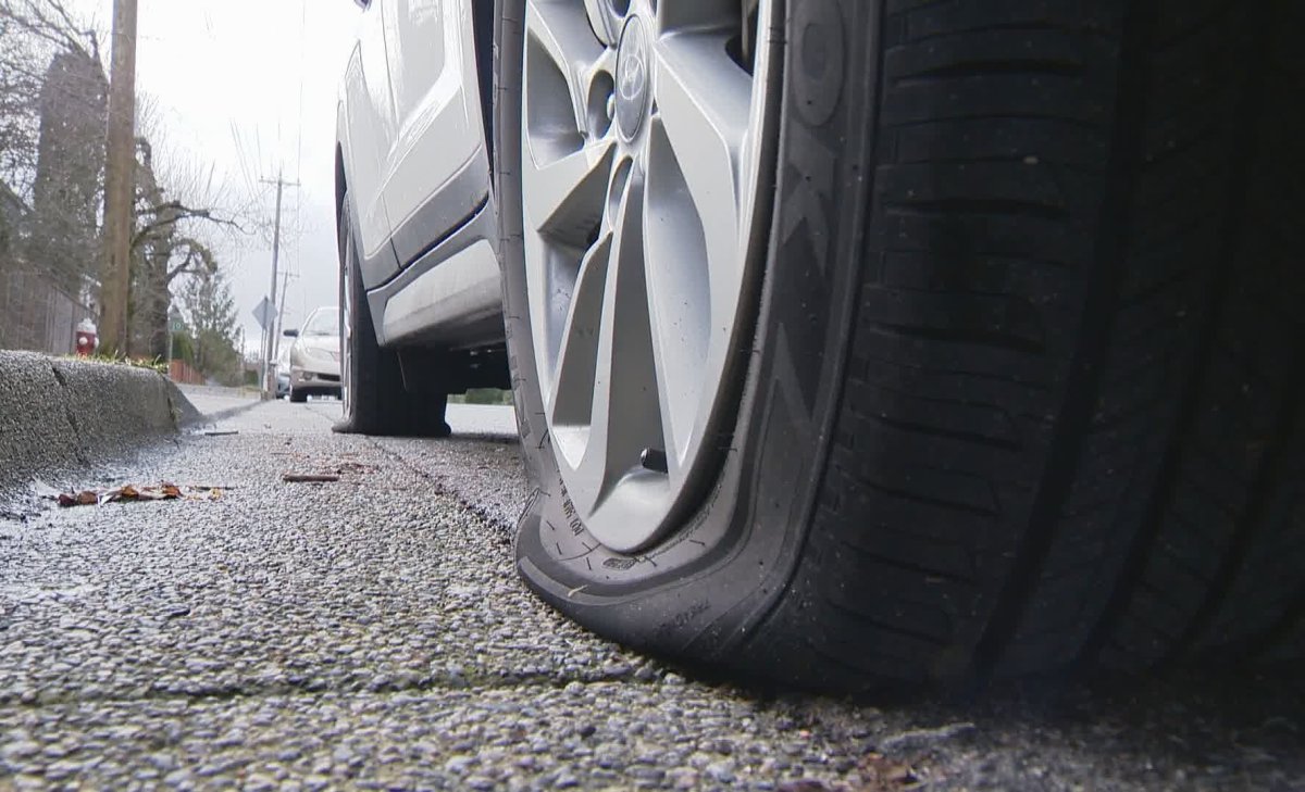 Slashed tires seen on one of several vehicles in a Maple Ridge neighbourhood on Feb. 16, 2020.