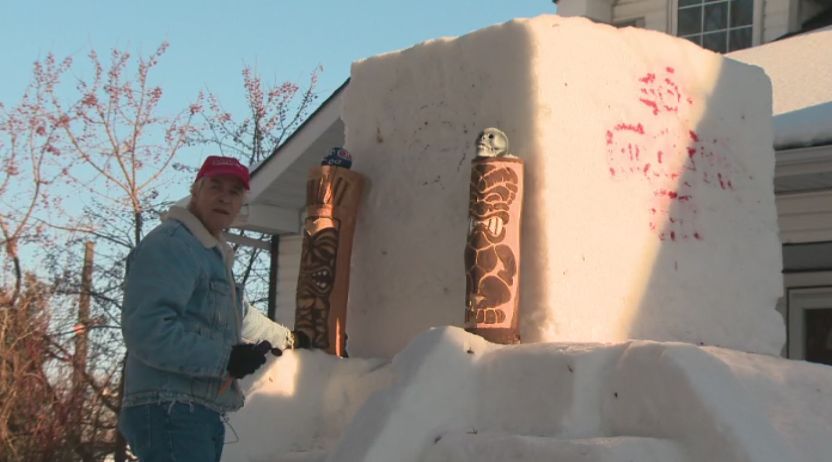 Gerry Kaluzniak sculpts the Chichén Itzá pyramid out of snow in his front yard at his Edmonton home, Sunday, Feb. 2, 2020. 