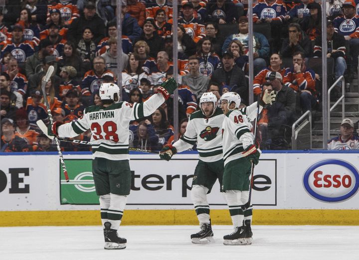 Minnesota Wild's Ryan Hartman (38), Marcus Foligno (17) and Jared Spurgeon (46) celebrate a goal against the Edmonton Oilers during second period NHL action in Edmonton, Alta., on Friday February 21, 2020. THE CANADIAN PRESS/Jason Franson.