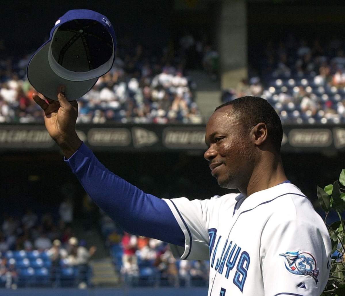 Toronto Blue Jays' Tony Fernandez tips his hat to the crowd as he takes part in a pre-game ceremony against the Tampa Bay Rays in Toronto Sunday September 23, 2001.