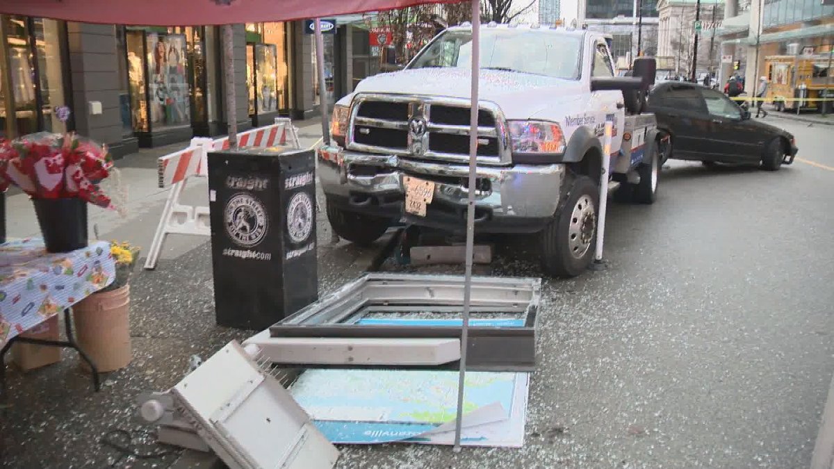 A tow truck sits stopped in downtown Vancouver after smashing into a nearby flower stand on Feb. 13, 2020.