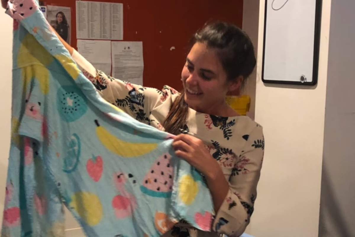 Dr. Olivia Clarke holds up a towel removed from a snake at the Small Animal Specialist Hospital in Sydney, Australia, on Feb. 19, 2020.