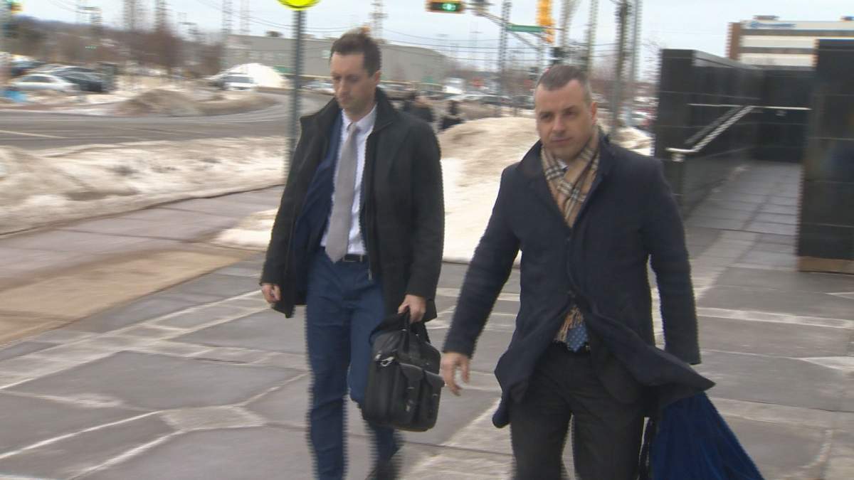 Van Horlick’s defence lawyer, Nathan Gorham (right), leaves the Moncton courthouse Thursday morning after suggesting he may seek a mistrial in the case
