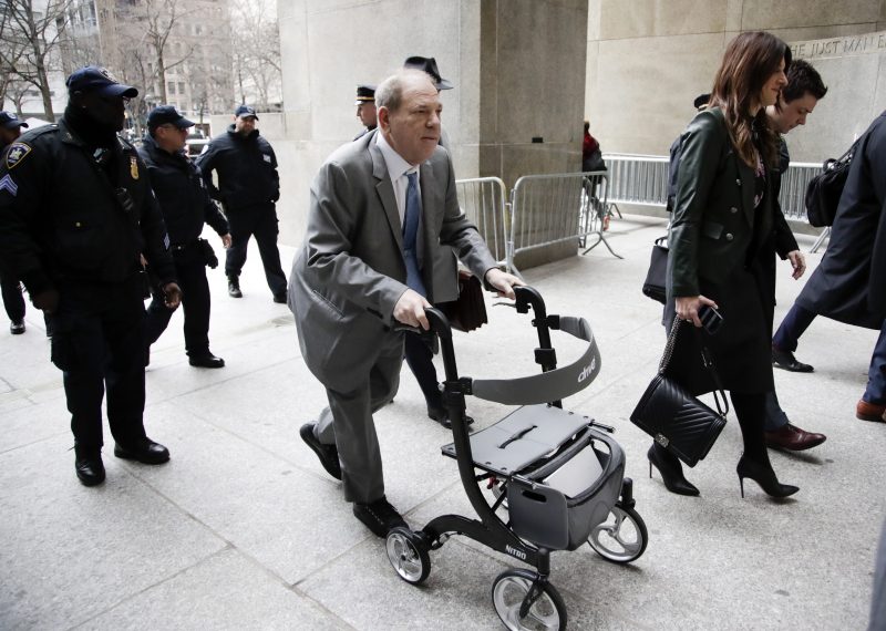 Former Hollywood producer Harvey Weinstein (C) arrives for his sexual assault trial at New York State Supreme Court in New York, New York, on Feb. 18, 2020.