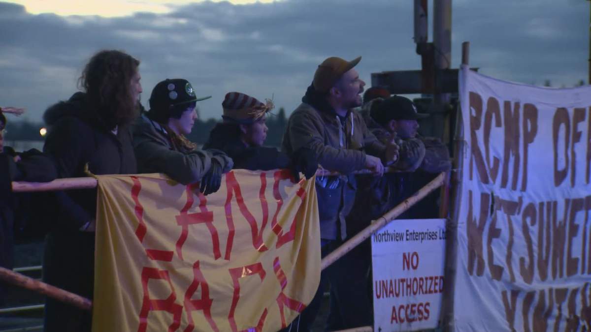 Activists with the Red Braid Alliance block rail tracks in Maple Ridge on Monday, Feb. 24, 2020. 