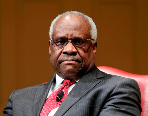In this Feb. 15, 2018, file photo, Supreme Court Associate Justice Clarence Thomas sits as he is introduced during an event at the Library of Congress in Washington.