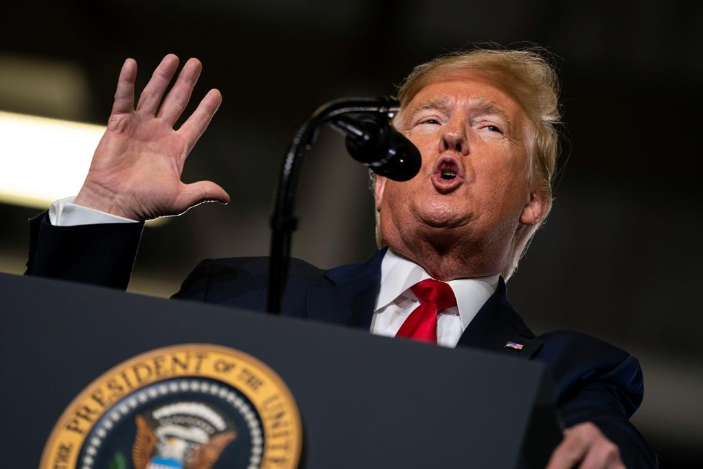 FILE- In this Jan. 28, 2020, file photo, President Donald Trump speaks during a campaign rally at the Wildwoods Convention Center Oceanfront in Wildwood, N.J. Trump will be facing his accusers Tuesday night during his State of the Union speech. The impeached president is speaking on the eve of what's anticipated to be his Senate acquittal on Wednesday.