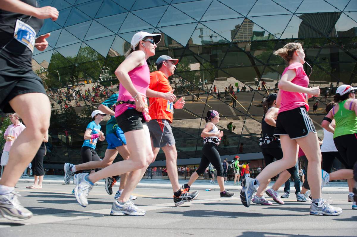 Runners taking part in the Ottawa Race Weekend half-marathon are seen in front of the Shaw Centre downtown on Sunday, May 27, 2012.