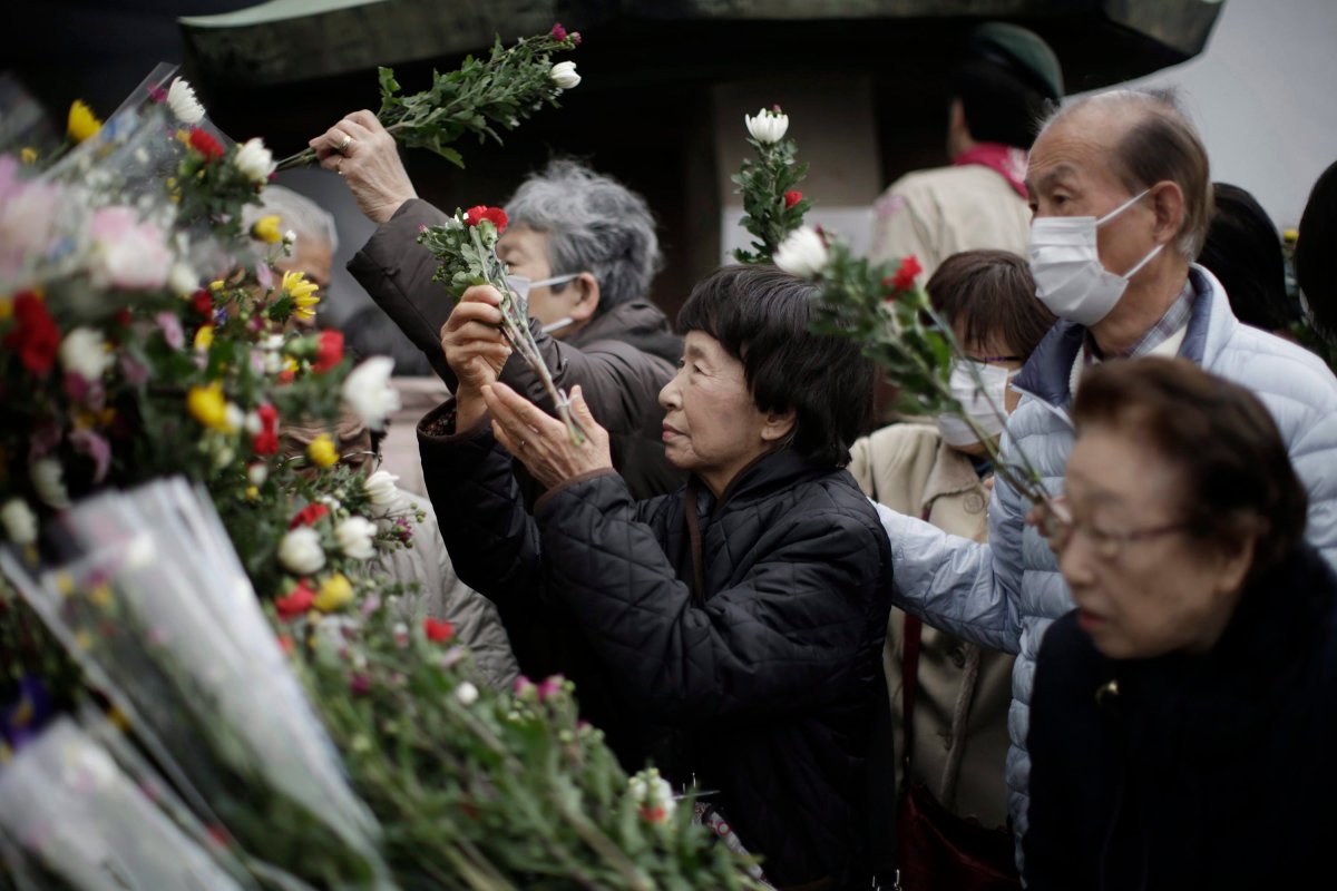 From 2015, Visitors offer flowers outside the Tokyo Memorial Hall after the Tokyo firebombing memorial service marking the anniversary of the air raid, known as the Great Tokyo Air Raid, on Tokyo. Some 105,400 people died in a single night when U.S. B-29 bombers obliterated much of Tokyo in the deadliest conventional bomb attack ever. 