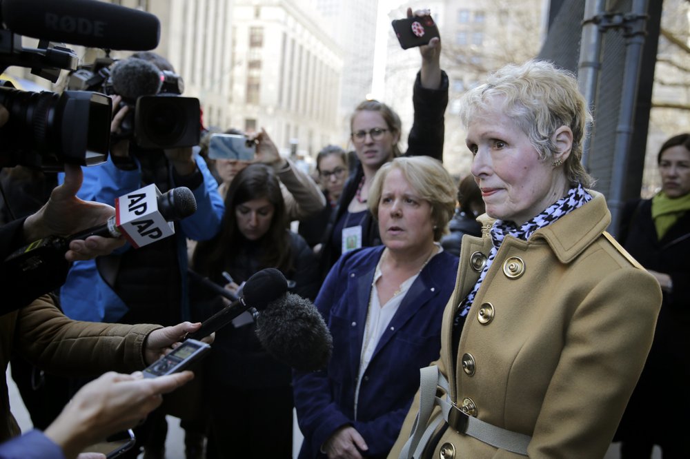 E. Jean Carroll, right, talks to reporters outside a courthouse in New York, Wednesday, March 4, 2020. As part of her defamation lawsuit against President Donald Trump, Carroll is seeking a DNA sample from him in an attempt to prove he raped her in the 1990s, which Trump denies.