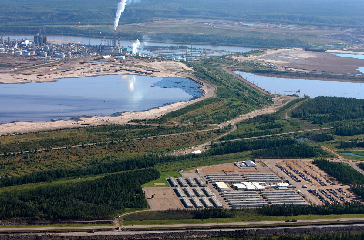 A file photo of the oilsands and a housing camp.