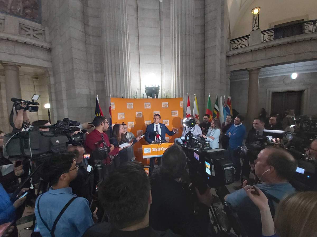 Media scrum Manitoba NDP leader Wab Kinew Wednesday.