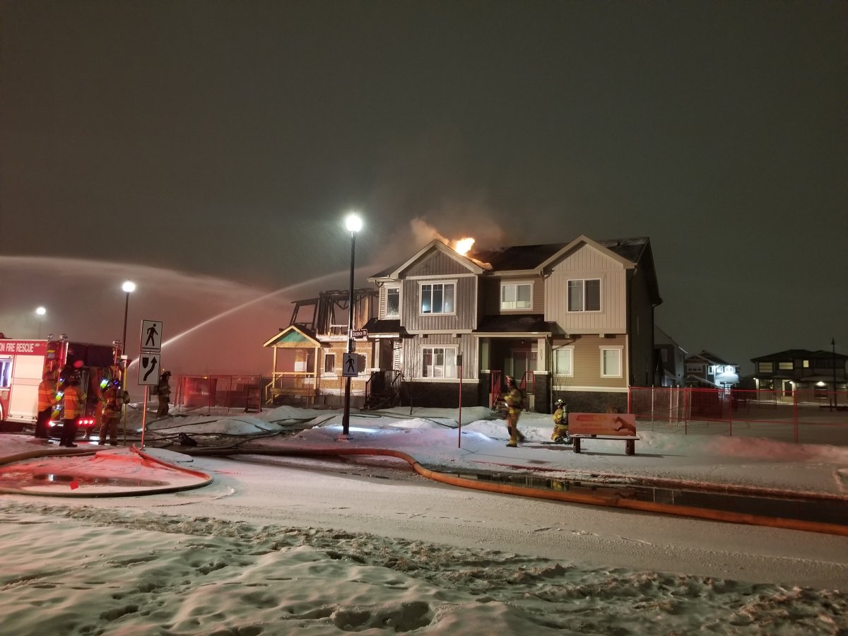 Edmonton Fire Rescue Services responds to a blaze at a home under construction at 203 Griesbach Rd. N.W. on Monday, March 23, 2020. 