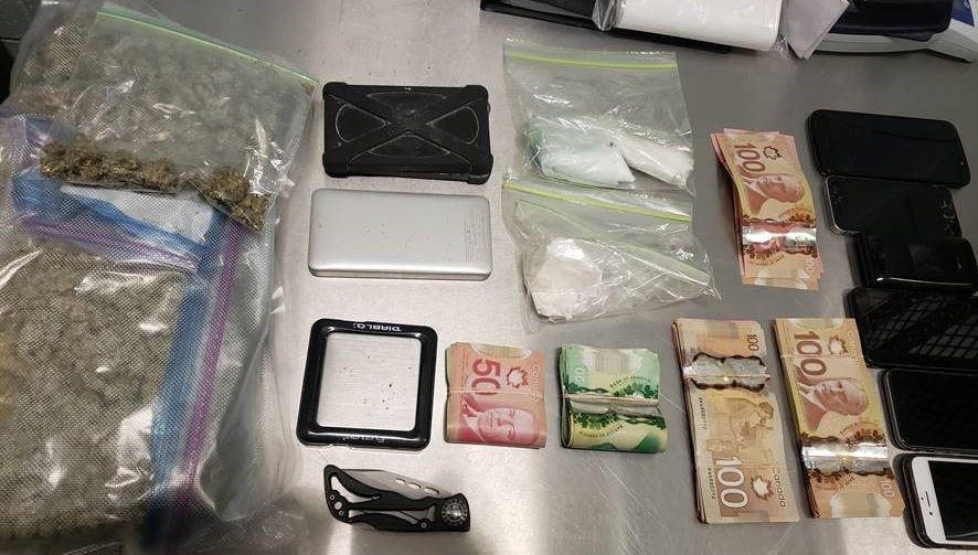 Officers found the man to be in possession of a large amount of cannabis, a small amount of cocaine, several cellphones, a large amount of cash and a knife.