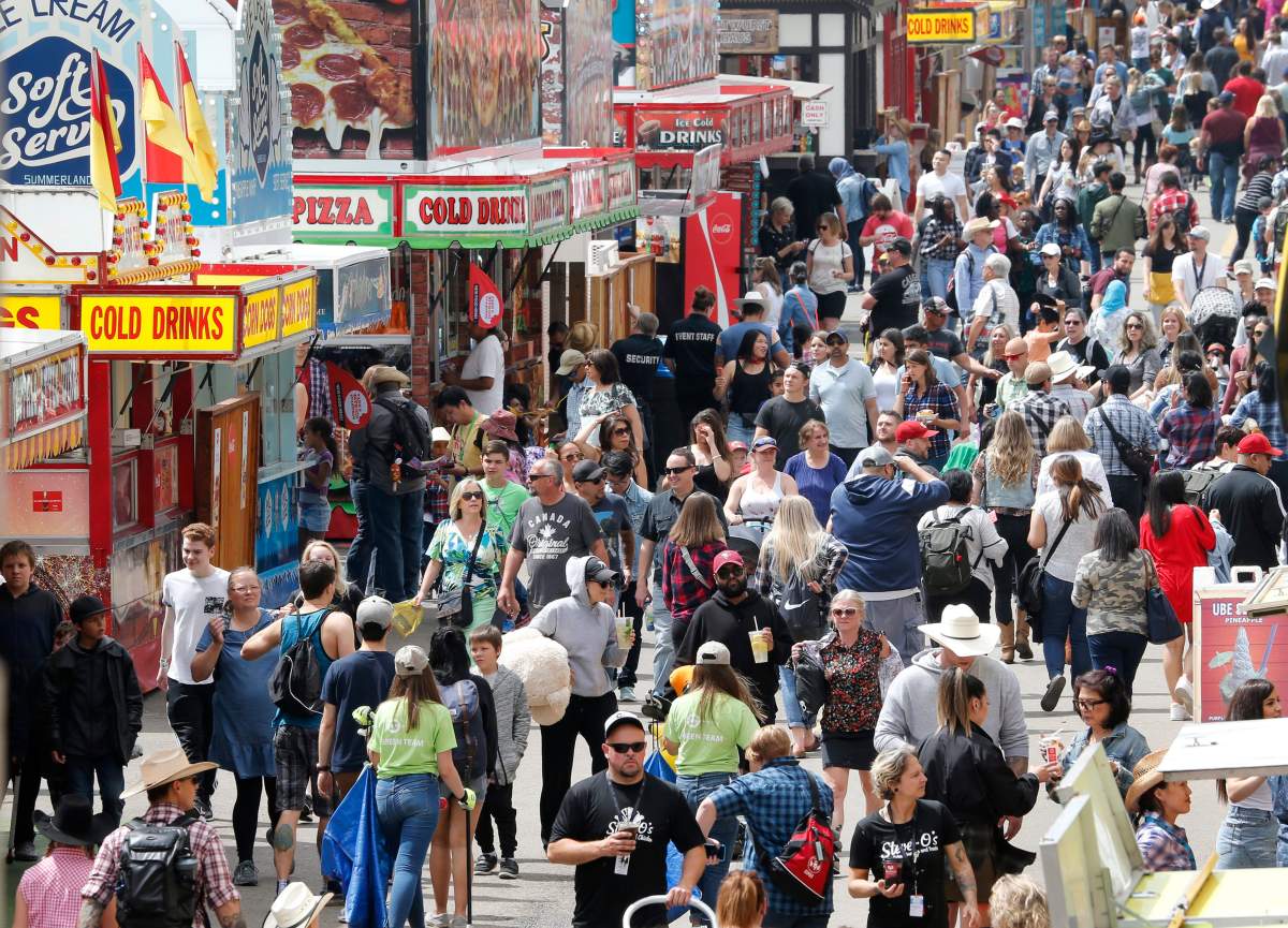 Crowds on the midway grounds at the Calgary Stampede on July 10, 2019.