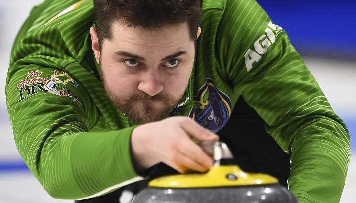 Team Saskatchewan skip Matt Dunstone delivers as they take on Team BC at the Brier in Kingston, Ont., on March 2, 2020. 