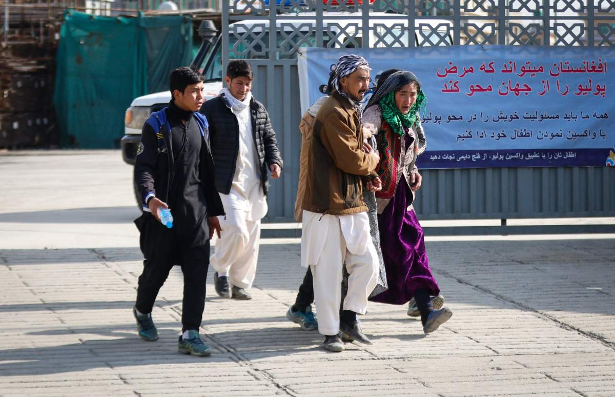 An Afghan woman who lost her family member reacts as she visits the hospital after she gunmen attacked a political gathering in Kabul, Afghanistan, 06 March 2020. 