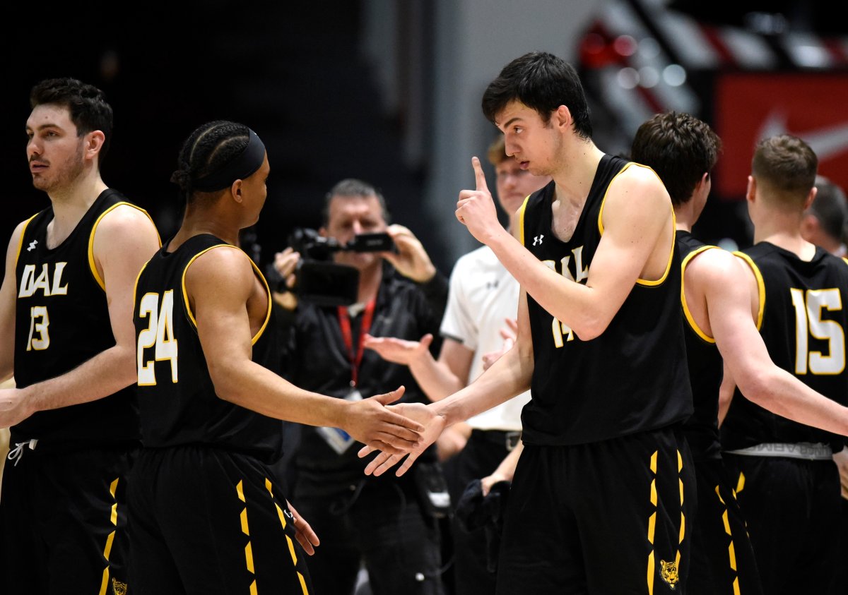 Dalhousie Tigers forward Sascha Kappos (14) gestures to teammates as they celebrate their win against the UBC Thunderbirds during the second half of semi-final U Sports Final 8 Championships basketball action in Ottawa, on Saturday, March 7, 2020. 