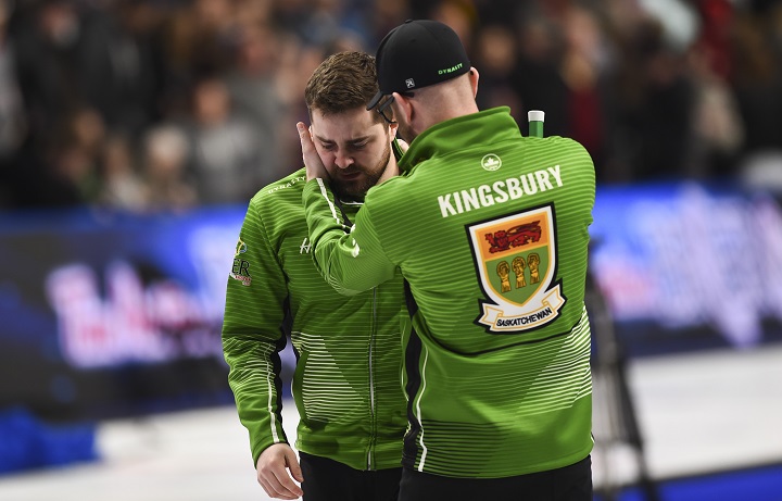 Team Saskatchewan skip Matt Dunstone, gets a hug from coach Adam Kingsbury as he reacts to a 7-6 loss to Team Newfoundland skip Brad Gushue in the Brier semifinal in Kingston, Ont., on Sunday, March 8, 2020 .