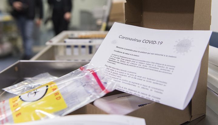 A COVID-19 information letter is shown at a coronavirus evaluation clinic in Montreal, Tuesday, March 10, 2020. 