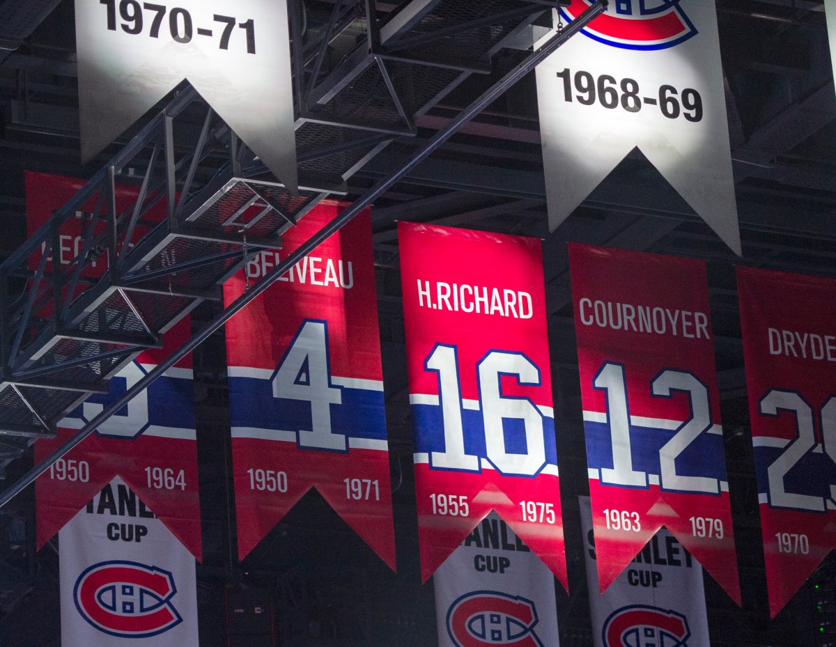 The retired jersey number of Former Canadiens great Henri Richard, who died Friday at the age of 84, is highlighted during a tribute before the team's NHL game against the Nashville Predators Tuesday, March 10, 2020 in Montreal. 