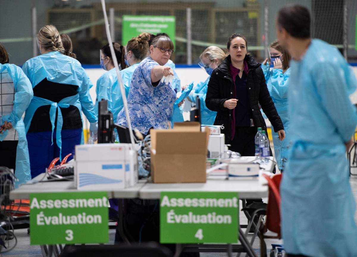 Medical staff prepare for the opening of the COVID-19 Assessment Centre at Brewer Park Arena in Ottawa, during a media tour on Friday, March 13, 2020. The assessment centre, operated by The Ottawa Hospital and CHEO, is an out-of-hospital clinic where people can be assessed and tested for COVID-19 if required.