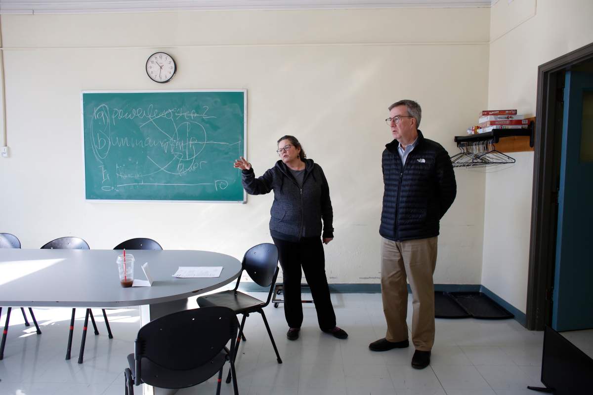 Wendy Muckle, CEO of Ottawa Inner City Health gives Ottawa Mayor Jim Watson a tour of a community centre that will serve as a COVID-19 isolation centre for vulnerable residents starting Monday, in downtown Ottawa on Saturday, March 21, 2020. Ottawa has turned a local recreation centre into an isolation and treatment centre for homeless people with confirmed or suspected cases of COVID-19.