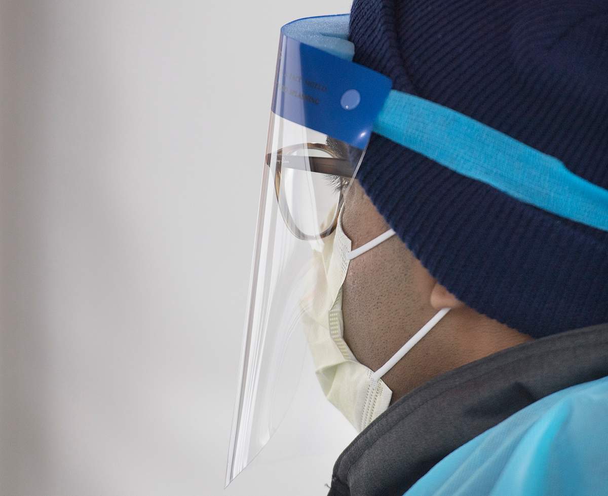 A health-care worker looks on at a drive-thru COVID-19 test clinic in Montreal, Sunday, March 29, 2020.