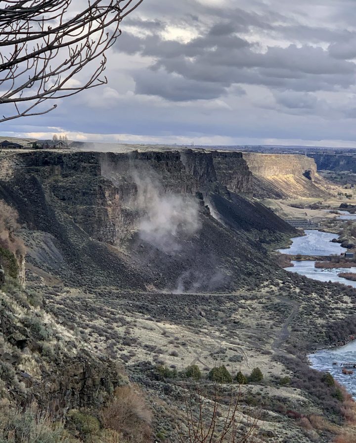 In a photo provided by Israel Bravo, rocks fall from the north side of the Snake River Canyon during an earthquake, Tuesday, March 31, 2020, near Twin Falls, Idaho. A large earthquake struck north of Boise on Tuesday evening, with people across a large area reporting shaking.