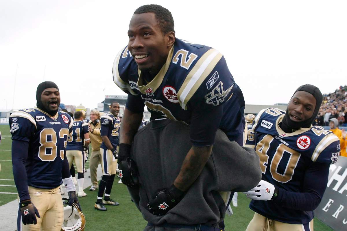 Winnipeg Blue Bombers' Jovon Johnson (2) is raised high after returning a punt 75 yards for a touchdown against the Montreal Alouettes in second half CFL action in Winnipeg, Saturday, October 24, 2009.   Winnipeg Blue Bombers defeated Montreal Alouettes 41-24. 