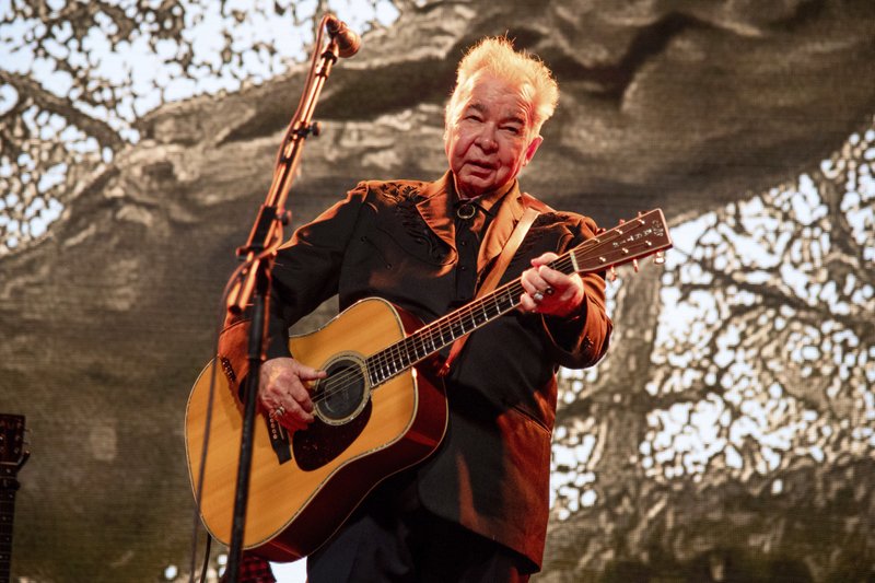This June 15, 2019 file photo shows John Prine performing at the Bonnaroo Music and Arts Festival in Manchester, Tenn. (Photo by Amy Harris/Invision/AP, File)